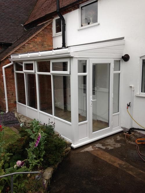 Brick-built hip-roof garden room with French door