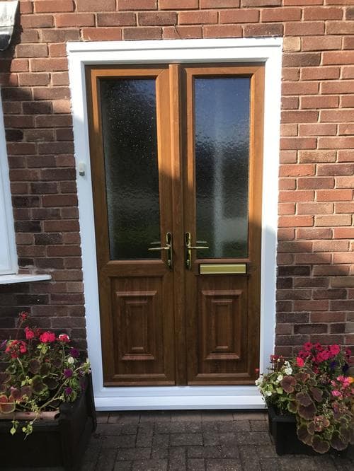 Golden oak French doors with glazed top panels