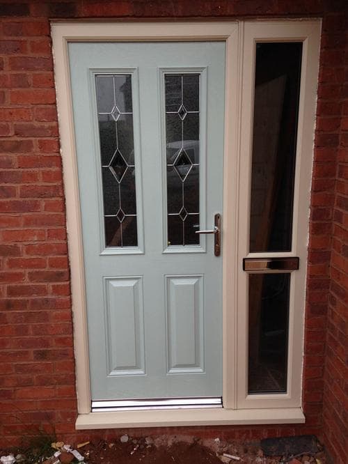 Sage green composite door with diamond leaded glazing
