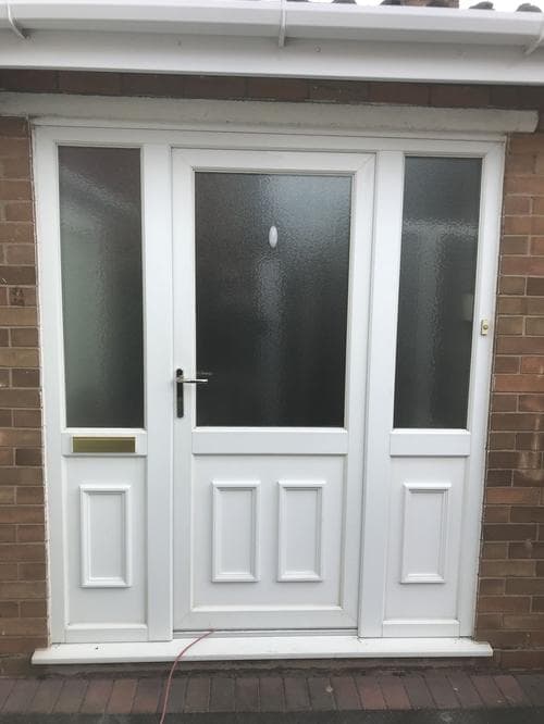 White stable-style door with matching sidelights