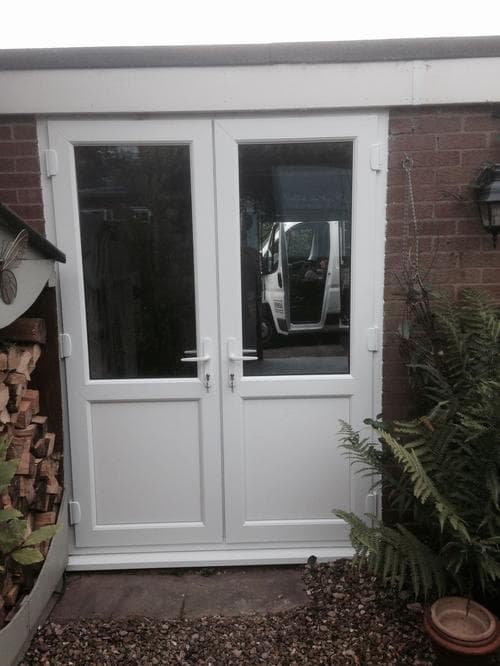 Golden oak bi-fold doors onto a garden