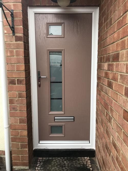 Taupe composite door with vertical glazing panels