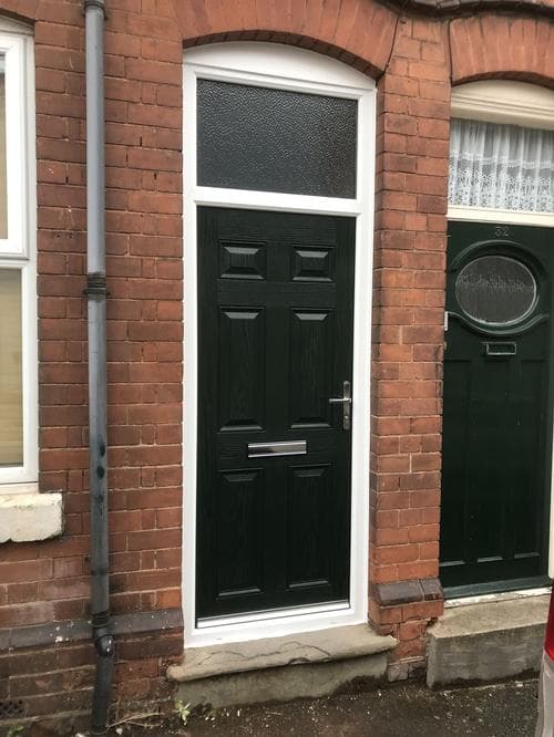 Racing green six-panel composite door with fanlight