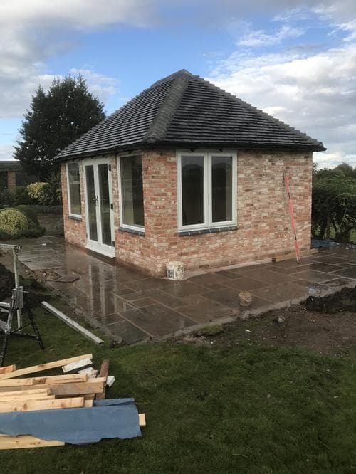 Brick garden room with casement windows and French door
