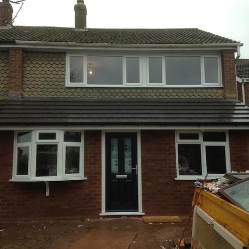 Dormer window with a run of white casement windows