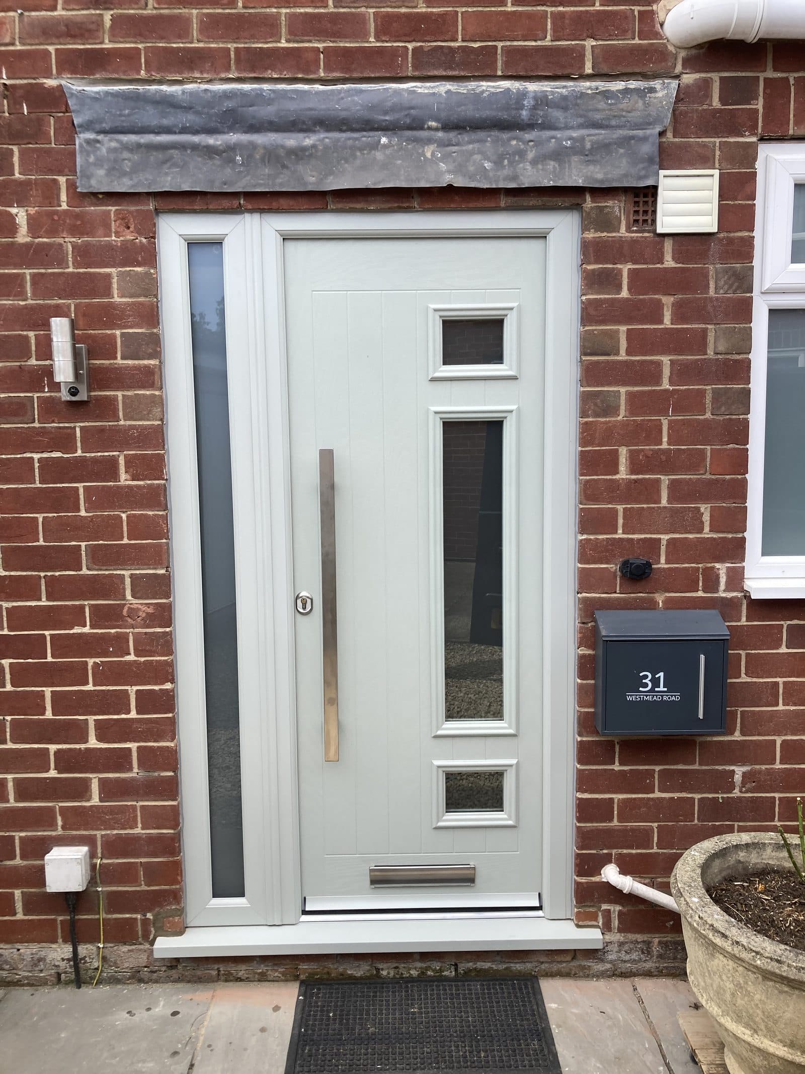 Sage green composite front door installation